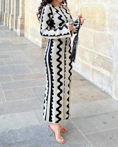 Detailed close-up of knitted wave pattern on a black and white two-piece long dress set