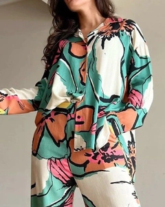 Detailed view of women's two-piece abstract print set with shirt and wide trousers
