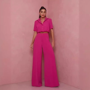 Women's rose pink two-piece set featuring short sleeve cropped shirt and wide leg pants