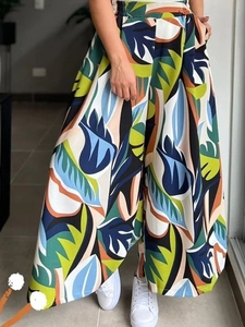 Women high waist wide leg trousers with colorful tropical leaf print in a relaxed fit