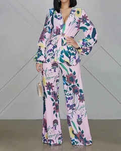 Detail of floral two-piece set with V-neck puff sleeve top and high waist wide leg pants
