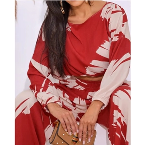 Women's 2-piece set with long sleeve crop top and high waist wide leg pants in abstract print