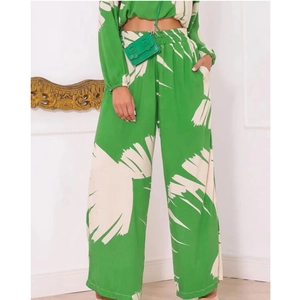 Green and white abstract print two-piece set with cropped top and wide-leg trousers