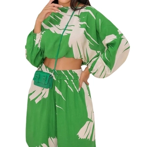 Women's emerald green floral two-piece set with long sleeve crop top and wide leg pants