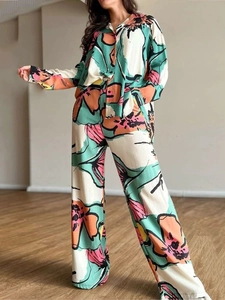 Elegant floral print two-piece set featuring long sleeve shirt and high waist wide leg pants