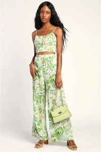 Detail of floral two-piece set featuring cami crop top and high-waist wide-leg pants