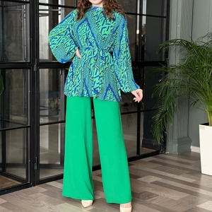Women's two-piece fashion set with geometric puff sleeve blouse and green wide leg trousers
