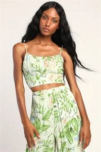 Detail of light green floral crop top and high-waisted wide-leg pants summer set