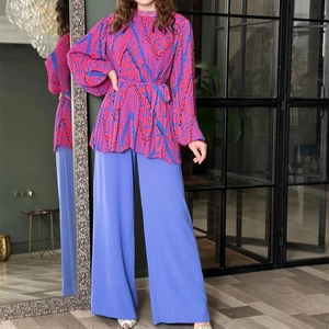 Women's two-piece fashion set with pleated puff sleeve shirt and high waist wide leg pants