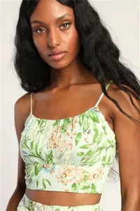 Detail of floral spaghetti strap crop top with pleated chest and green leaf pattern
