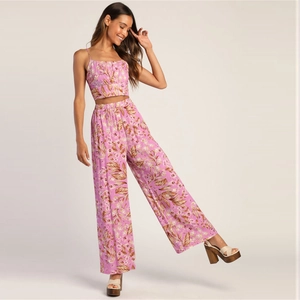 Women's pink floral two-piece set featuring cropped camisole top and high-waist wide-leg pants
