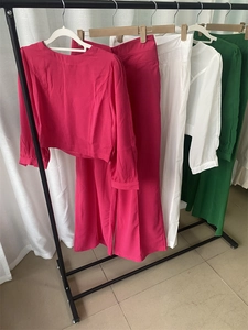 Detail of vibrant long sleeve top and wide leg pants set in multiple color options
