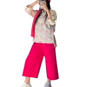 Women's two-piece linen set with abstract tree print blouse and pink wide-leg pants