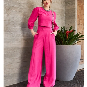 Chic rose pink two-piece set featuring lantern sleeve crop top and high-waisted wide-leg pants