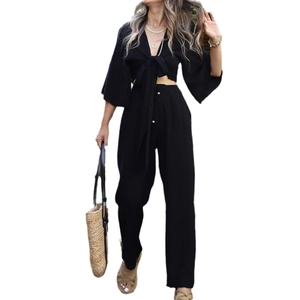 Women black two-piece set with flare sleeve tie-up top and high waist wide leg pants