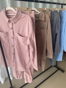 Detail of corduroy texture on lounge sets with vintage buttons and cargo pockets