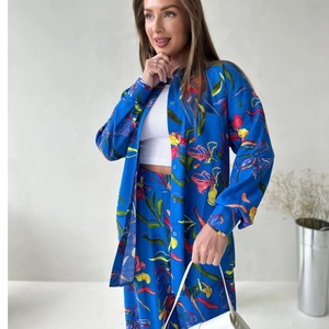 Women's two-piece set with vibrant floral print shirt and straight trousers in royal blue