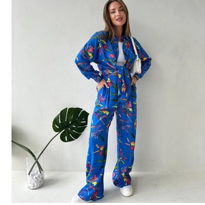 Women's two-piece floral set with vibrant blue shirt and wide-leg trousers