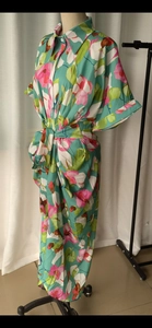 Detail of floral shirt dress with lapel collar, short sleeves and matching waist belt