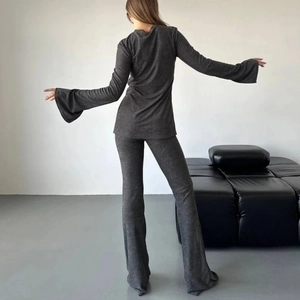 Women's dark grey ribbed knit two-piece set with bell sleeves and flared trousers