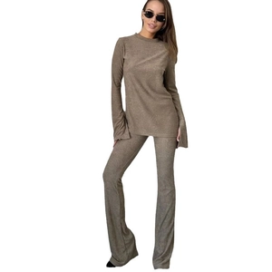 Slim fit brown ribbed knit two-piece set featuring long sleeve top and flare leg pants