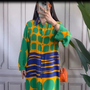 Relaxed fit long sleeve maxi dress with vibrant geometric prints and button-down front