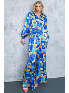 Detailed view of women's floral satin two-piece set featuring wide-leg pants and blouse
