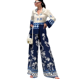 Women's two-piece set with printed long sleeve shirt and matching wide-leg trousers