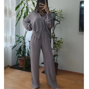 Women's light purple two-piece set with long-sleeve button-up shirt and wide-leg trousers