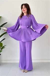 Detail of purple pleated long sleeve top with waist tie and matching wide leg pants set