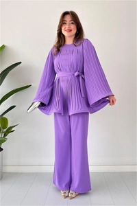Detail of purple pleated two-piece set featuring flare sleeves and wide-leg trousers
