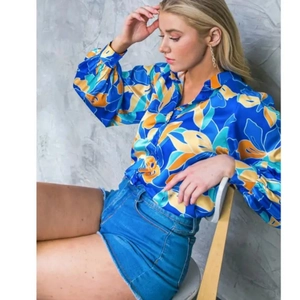 Women's floral print long sleeve shirt in royal blue satin with elegant puff sleeves