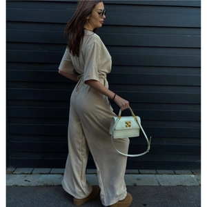Beige V-neck short sleeve jumpsuit with drawstring waist and wide-leg trousers