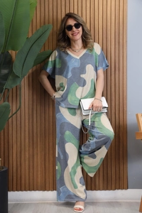 Detailed look at two-piece casual set featuring abstract print top and wide-leg trousers