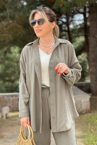 Detail view of olive green casual two-piece set featuring textured fabric and buttons