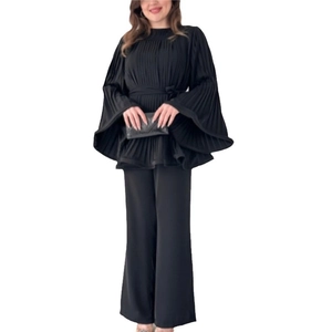 Women's black pleated set featuring bell sleeve top with waist tie and wide leg pants