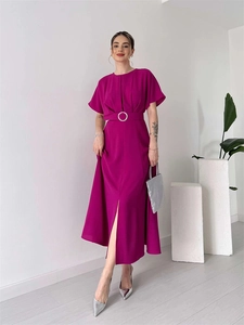 Detail of fuchsia midi dress featuring a pleated bust and silver ring buckle belt