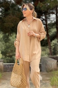 Outdoor shot of khaki loose long-sleeve shirt and straight pants set with natural texture