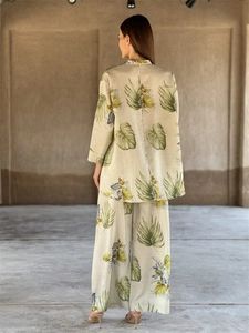 Rear view of linen blend set with tropical leaf print and loose wide leg pants