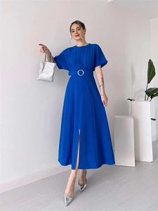 Detail of royal blue dress featuring waist belt with silver ring and front slit
