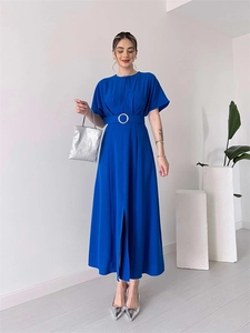 Close-up of royal blue midi dress featuring high slit and waist belt with silver buckle