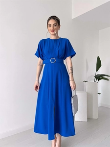 Close-up of royal blue midi dress featuring waist belt with silver metal buckle and front slit