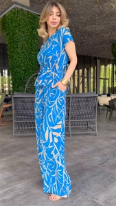 Detail of blue floral print set showing side pockets on high waist wide leg trousers