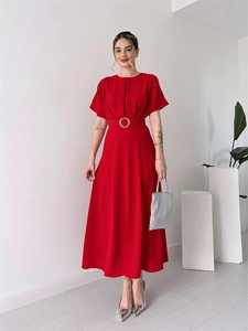 Detail of red short sleeve midi dress with pleated chest and round metal buckle belt