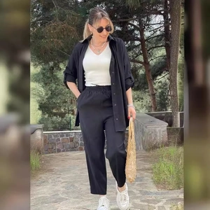 Three-piece women's casual set with black long sleeve shirt, white vest and loose trousers