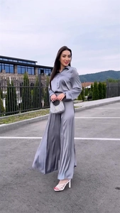 Detail of silver grey satin long sleeve shirt and high waist wide leg trousers set