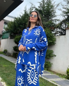 Detail of the blue abstract print two-piece set featuring wide-leg pants and a loose top