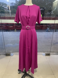 Detail of rose pink dress featuring bust pleats and waist belt with silver metal buckle