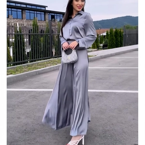 Elegant grey satin two-piece set featuring long sleeve shirt and high waist wide leg trousers