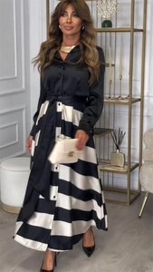 Détail d'une robe rayée 2-en-1 avec corsage en satin et ceinture nouée noir et blanc
